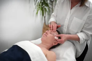 Gua Sha being performed with a tool